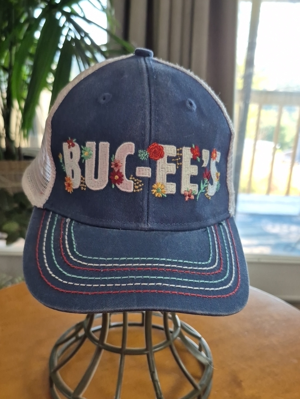 Buck-ee's Floral Navy Mesh Ponytail Trucker Hat